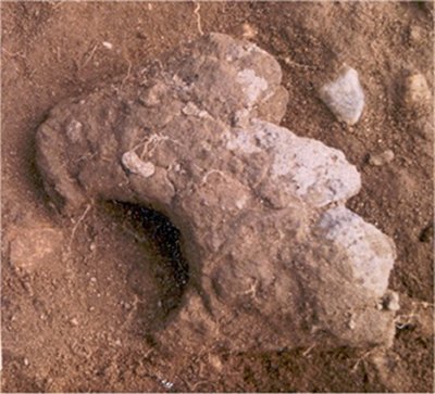 Part of a shaped stone