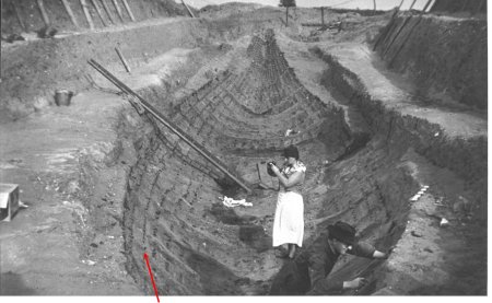 People working in imprinted boat in the ground