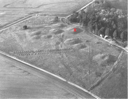 Black and white photo of burial mounds