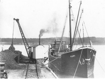 Steamer boat delivering coal