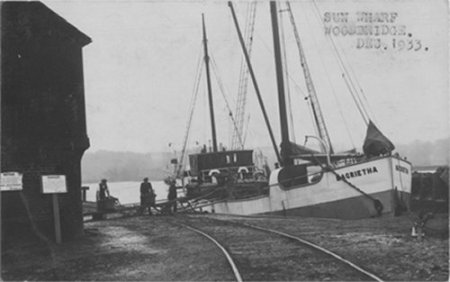 A Dutch coaster delivering dried peas near rail track