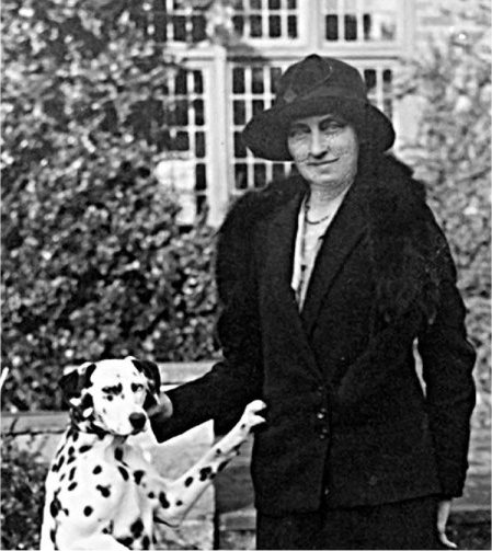 Smart lady in black with dalmatian dog