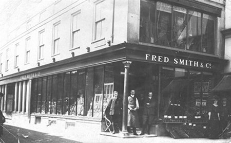 Corner of shop with men standing