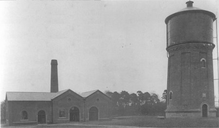 Tall water tower and buildings
