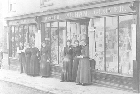 Women standing outside shop