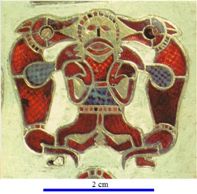 Ornate figure inlaid with red