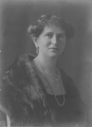 Woman wearing fur coat and pearls