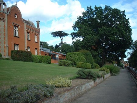 Red house with grass and bath