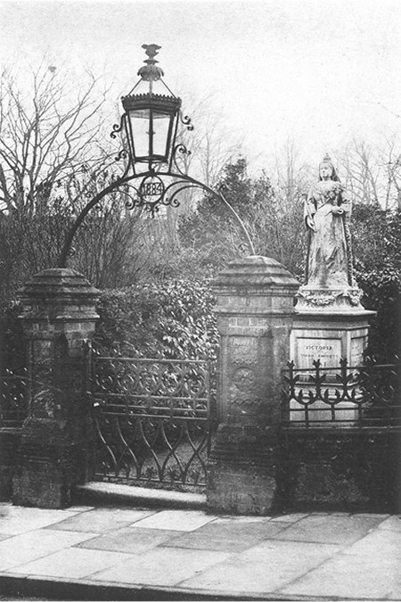 Ornate iron gate to queens statue
