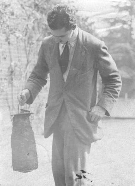 Man carrying cylinder shaped object